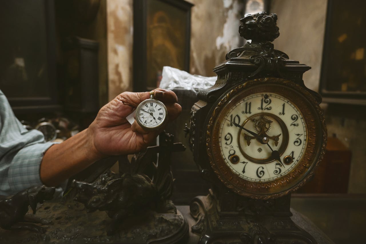 Explore the charm of antique clocks with intricate designs in a Kolkata workshop setting.